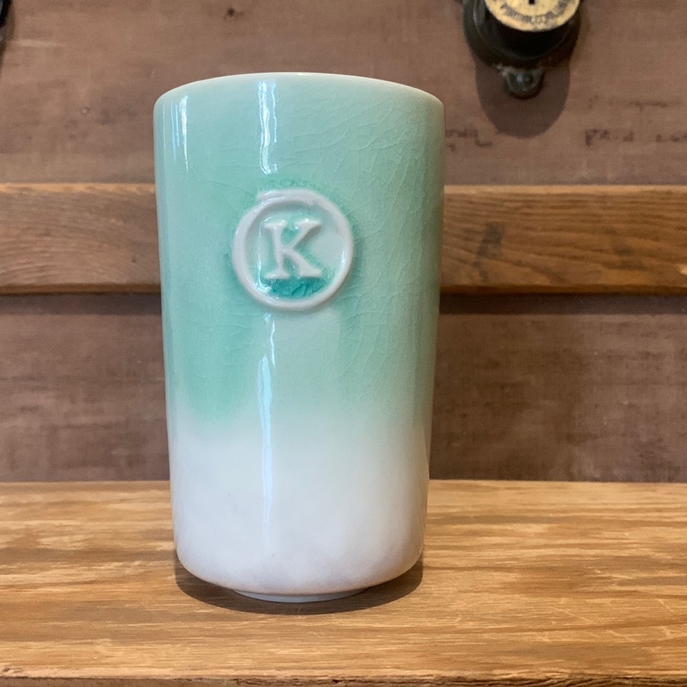Anthropologie. Tall Ceramic cup. Two toned monogramed with a K.
